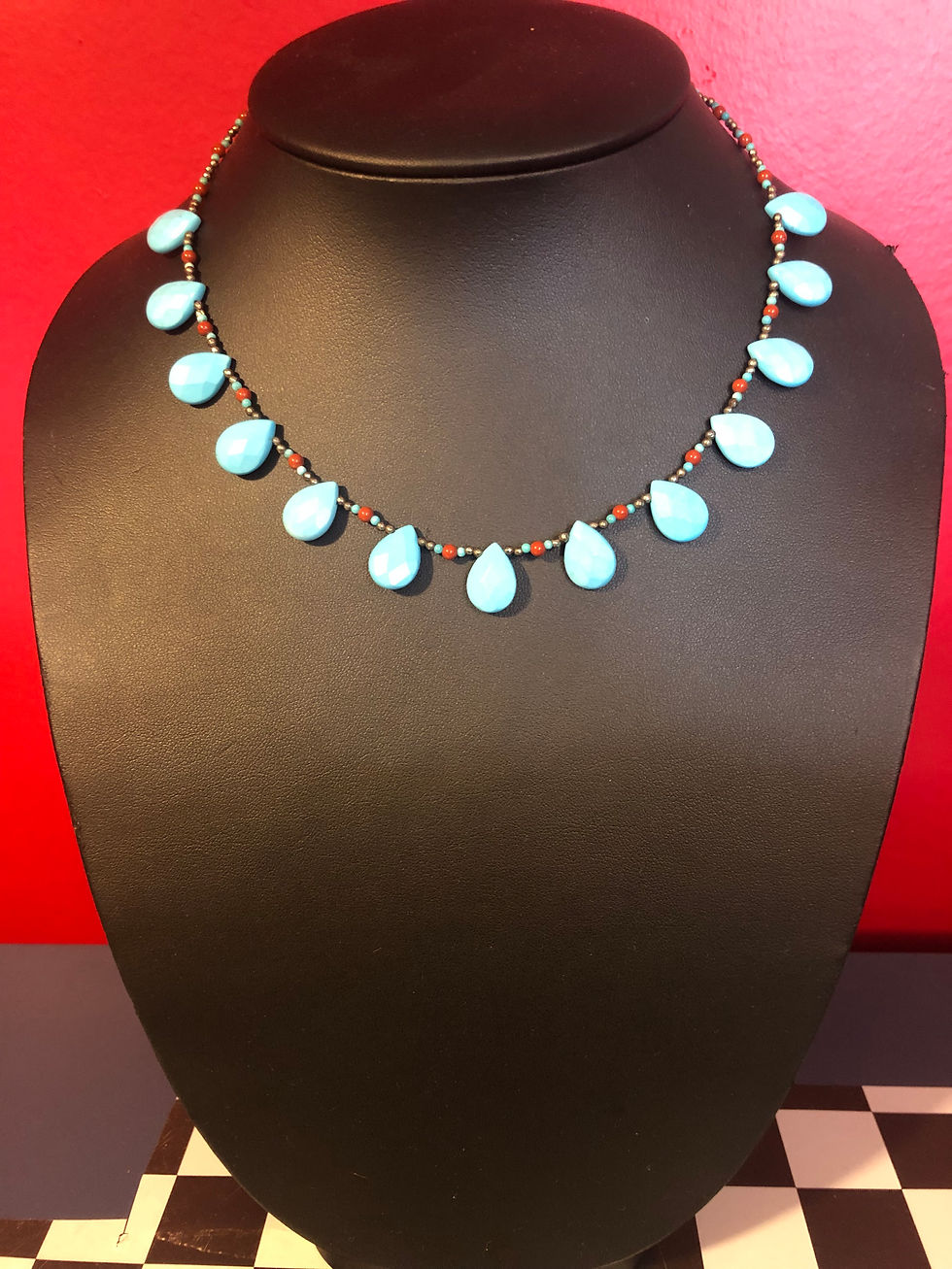 Turquoise drops with corals.