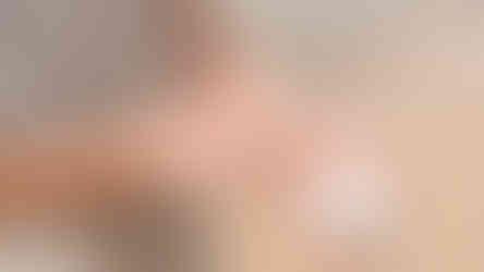 women applying zinc sunscreen to her wrist with open tin in her hand