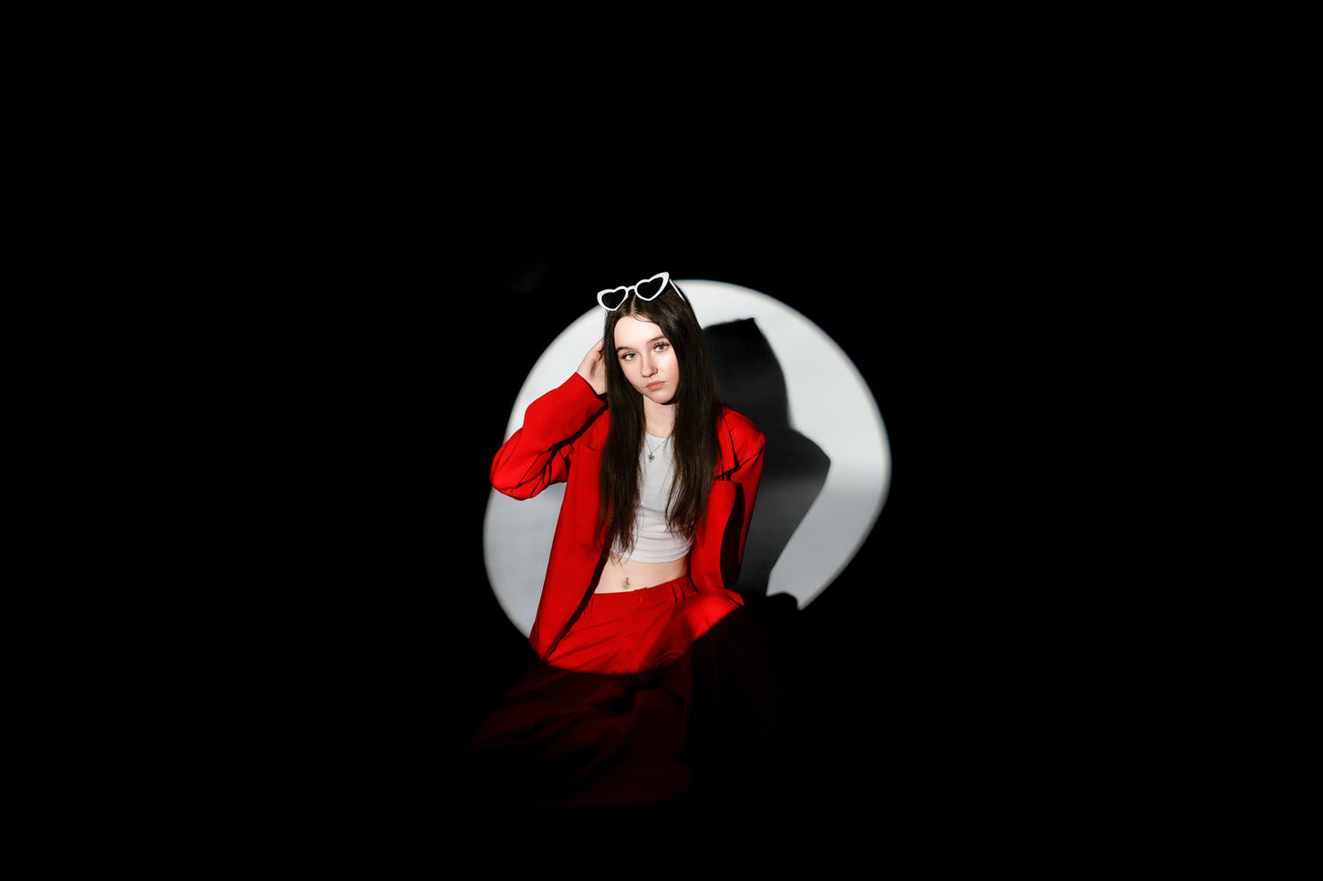 Woman in red suit, sunglasses; LP WEDDING PHOTOGRAPHY