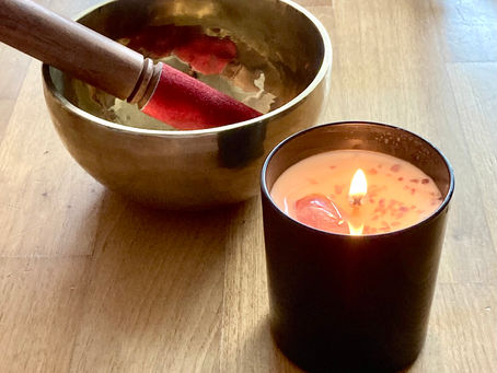 A singing bowl and a lavender candle