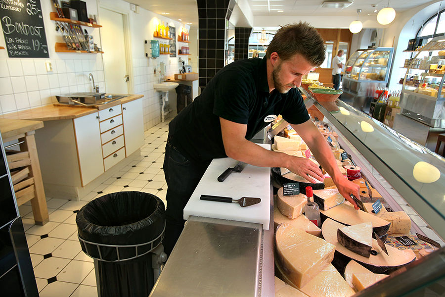 Man working in supermarket deli section