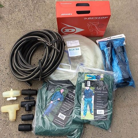 Dairy farming equipment and protective workwear including hoses, fittings, a Dunlop box, a