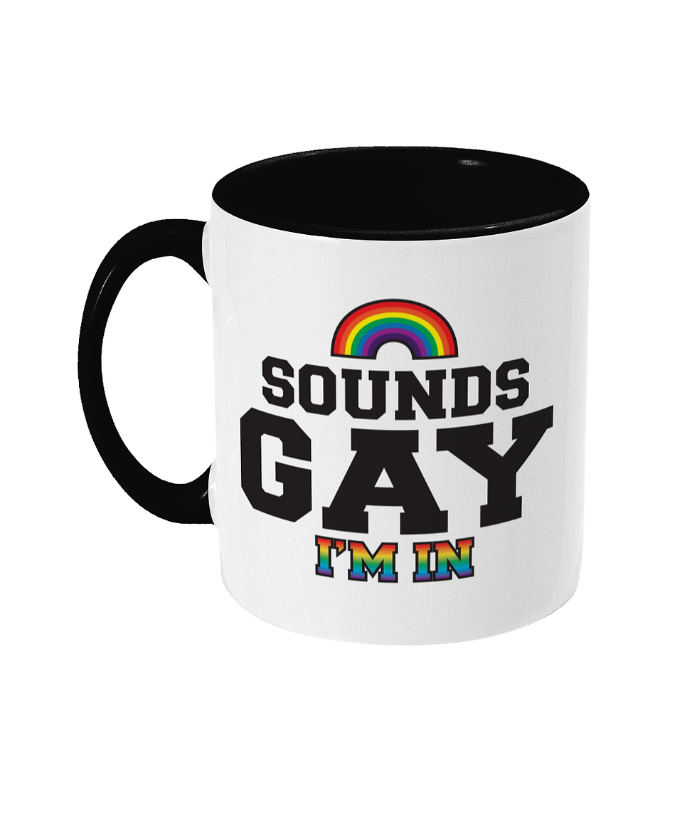 Thumbnail: Sounds Gay, I'm In bold lettering funny design with Rainbow and Rainbow lettering printed onto a black and white mug