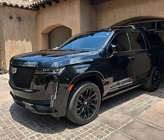 Full paint correction and multi-year ceramic coating on an Escalade near Kierland Commons - Mobile detailing van performing a deep interior clean in Gainey Ranch - Scottsdale Detail Co.