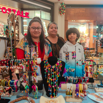 Vendors at the 2023 Latin American Marketplace jewelry stall.