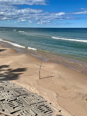 A driftwood cross by Lake Michigan