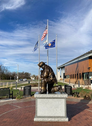 Statue of a fireman kneeling in prayer