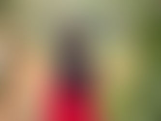 Sacramento family posing together during a fall session at The Iris Farm surrounded by autumn leaves and greenery, photographed by Kristina Martin Photography.