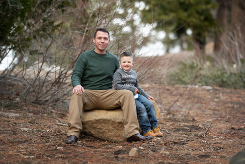 Winter family photos in the snow by best Sacramento family photographer, capturing playful moments, sibling bonds, and the beauty of parenting in Emigrant Gap.