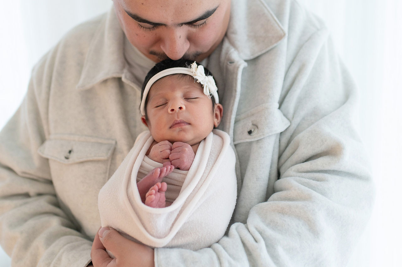 Lifestyle studio images from a newborn session by Kristina Martin Photography, featuring soft, timeless portraits of a baby girl and her family. Captured by one of the best maternity and newborn photographers in Sacramento.