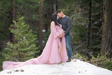 Snowy forest maternity session featuring a couple in soft, romantic colors. Captured by Kristina Martin Photography, best Sacramento maternity and newborn photographer.