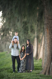 Pregnant mother and her family during an overcast maternity session at Gibson Ranch, captured with soft, natural light. Includes moments with siblings, partner, and a teddy bear holding baby’s heartbeat. Photographed by the best Sacramento maternity photographer.