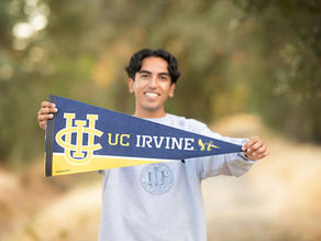 Senior portrait of Ali outdoors in Sacramento with personal items that reflect his interests and personality.