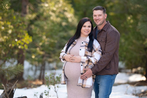 Snowy forest maternity session featuring a couple in soft, romantic colors. Captured by Kristina Martin Photography, best Sacramento maternity and newborn photographer.