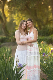 Sacramento family photographer capturing a spring iris farm family session with blooming irises, golden hour light, garden paths, and natural family portraits.