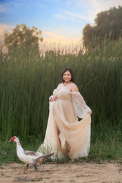 Beautiful maternity session at a Sacramento Ranch in California. Captured by the finest maternity photographer. A mother, her husband, and their shy but sweet daughter during golden California sunset.