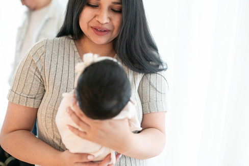 Lifestyle studio images from a newborn session by Kristina Martin Photography, featuring soft, timeless portraits of a baby girl and her family. Captured by one of the best maternity and newborn photographers in Sacramento.