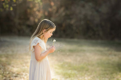 Family portraits at the Iris Farm, featuring a mother and her two daughters, captured by the best Sacramento family photographer.