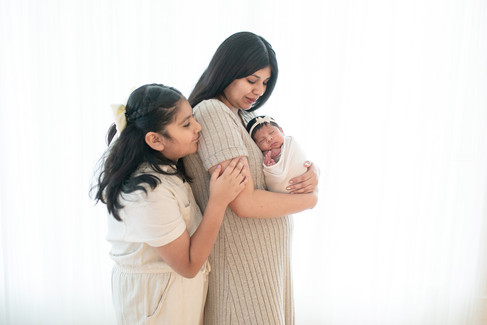 Lifestyle studio images from a newborn session by Kristina Martin Photography, featuring soft, timeless portraits of a baby girl and her family. Captured by one of the best maternity and newborn photographers in Sacramento.