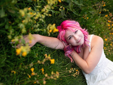 Sacramento senior photographer capturing a golden hour lavender farm senior session with wildflowers, willow trees, dock portraits, and natural personality-filled senior photos.