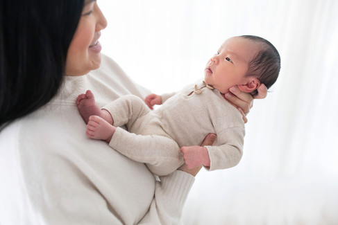 Newborn baby photographed in a neutral studio setting during an in studio newborn photography session in Roseville, California.