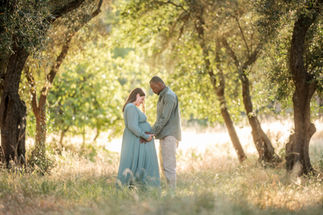 Couple walking hand in hand through a wooded path, sharing a quiet moment during their maternity session taken by Sacramento photographer Kristina Martin Photography.