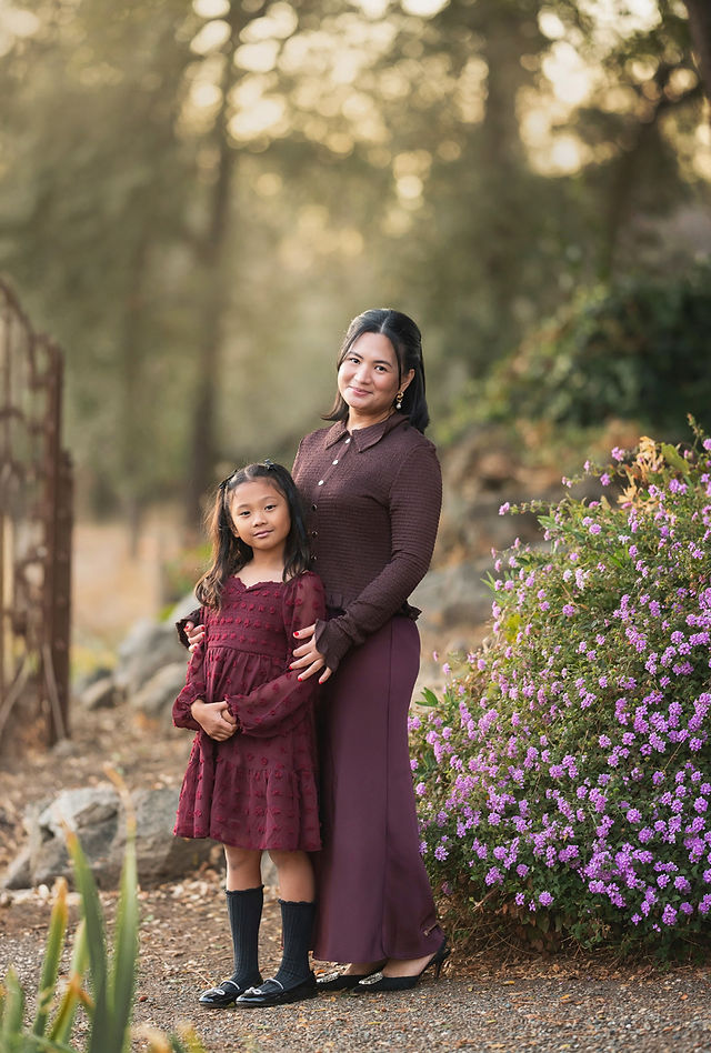 A beautiful family session captured by a Sacramento family photographer at the iris farm, featuring warm fall tones, genuine moments of connection, and golden light.