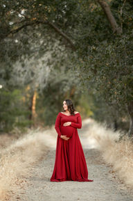 Beautiful maternity photos of Danielle wearing red maternity gown at Gibson Ranch, captured by the best Sacramento maternity photographer Kristina Martin.