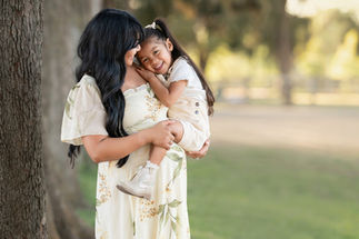 Sweet moment of a mother hugging her daughter, capturing the love between them by the best Sacramento maternity photographer.