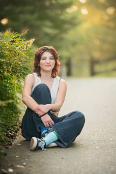 High school senior portraits at a scenic farm in Lincoln, California featuring golden evening light, open fields, waterfront views, swings, and natural outdoor backdrops.