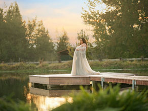 Expecting couple kissing during sunset at the lavender farm in Lincoln, CA surrounded by golden light, photographed by Sacramento and Roseville maternity photographer Kristina Martin.