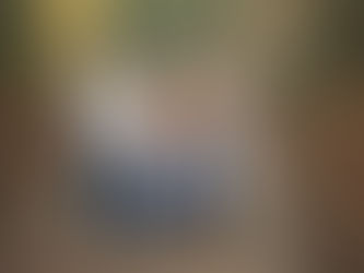 Extended family posing together on a wooden bridge at a Citrus Heights nature reserve during a fall family photography session.