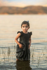 Portrait of Sasha's daughter standing in the water during a maternity shoot, the best Sacramento maternity photographer Kristina Martin Photography.