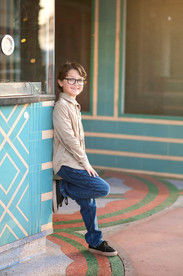 Downtown Roseville family photography session at sunset featuring a playful family walking, laughing, and interacting naturally in an urban setting.