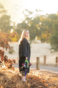 High school senior photographed by Kristina Martin Photography, Sacramento and Roseville senior photographer, in long golden grass during golden hour with soft, wispy light and warm neutral tones.