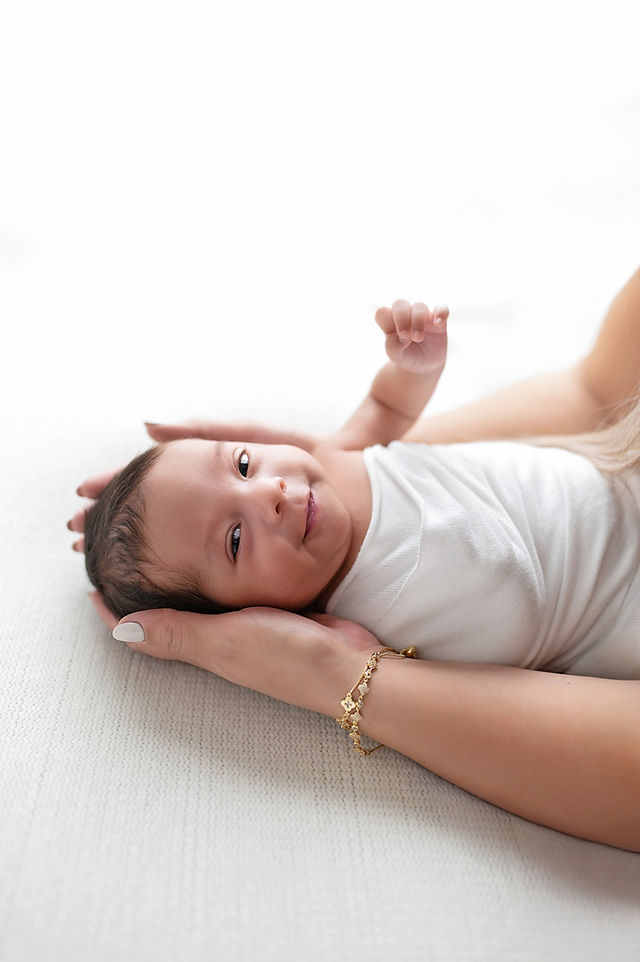 Newborn portraits of a baby boy with his family after a month in the NICU, captured by the best Sacramento newborn photographer.