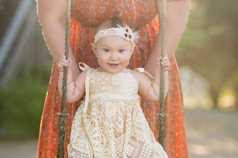 Family and first birthday photo session at Bywater Hollow Lavender Farm in Lincoln, California with Sacramento family photographer Kristina Martin Photography, featuring family portraits and a cake smash in golden evening light.