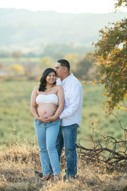 Expecting mother in a white top during a winter maternity session on her family’s property, captured by the best Sacramento maternity photographer