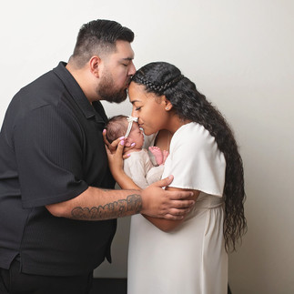 Parents holding newborn during in-home session | Best Sacramento newborn photographer