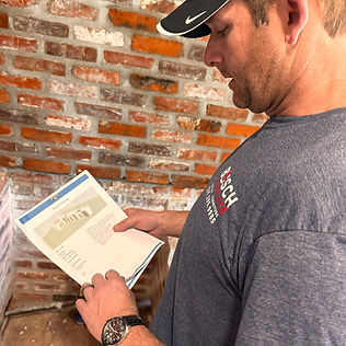 greg with outdoor kitchen plans.jpg