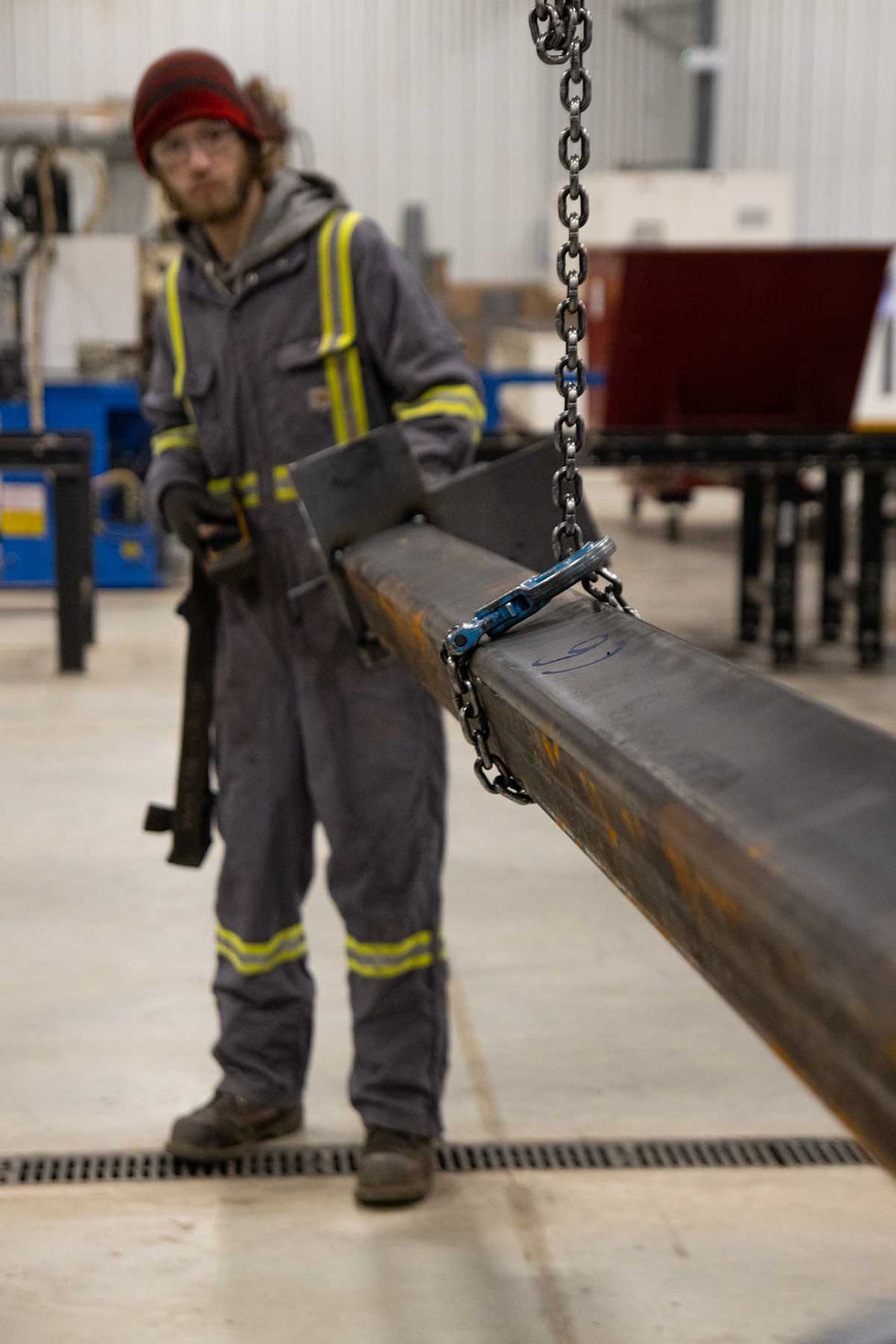 worker-with-steel-beam.jpg