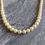 Thumbnail: Vintage Sylveke Pearl necklace in original box. Faux pearls 1920s. Pale Lemon yellow cream, single strand pearl beads.