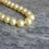 Thumbnail: Vintage Sylveke Pearl necklace in original box. Faux pearls 1920s. Pale Lemon yellow cream, single strand pearl beads.