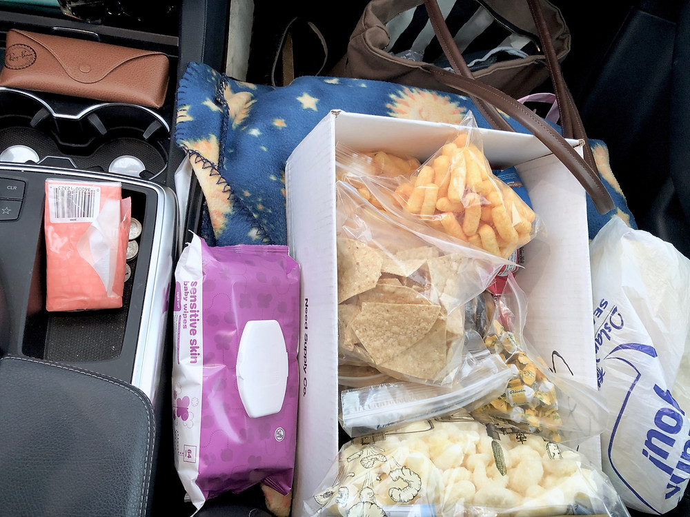 what to pack when you road trip with young kids -- a snack box, pack your car properly, and other tips! // sunnyinjune.com