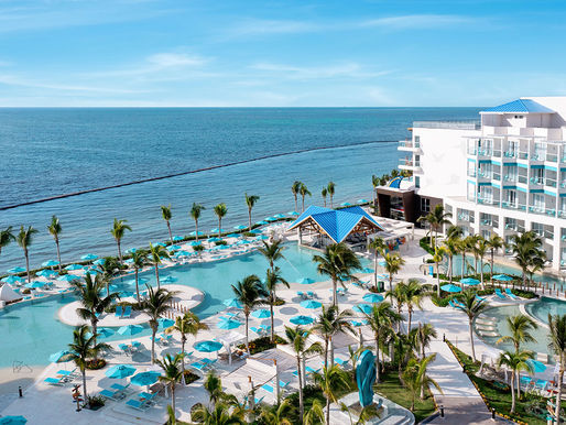 Adults-only resort pool overlooking the Caribbean sea in Riviera Maya, Mexico