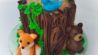 Sippin' Sweet Co. Tree Stump Cake Animals Custom.jpeg