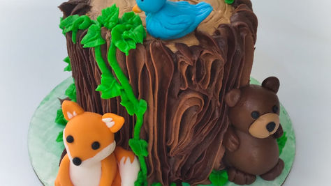 Sippin' Sweet Co. Tree Stump Cake Animals Custom.jpeg