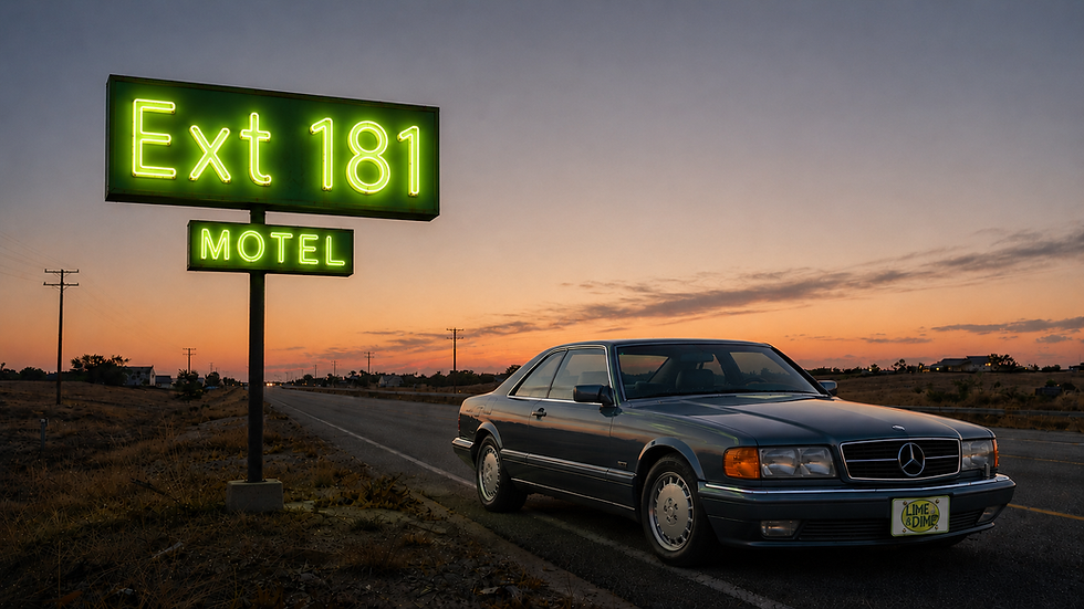Vintage Mercedes by an Ext 181 Motel sign at sunset.
