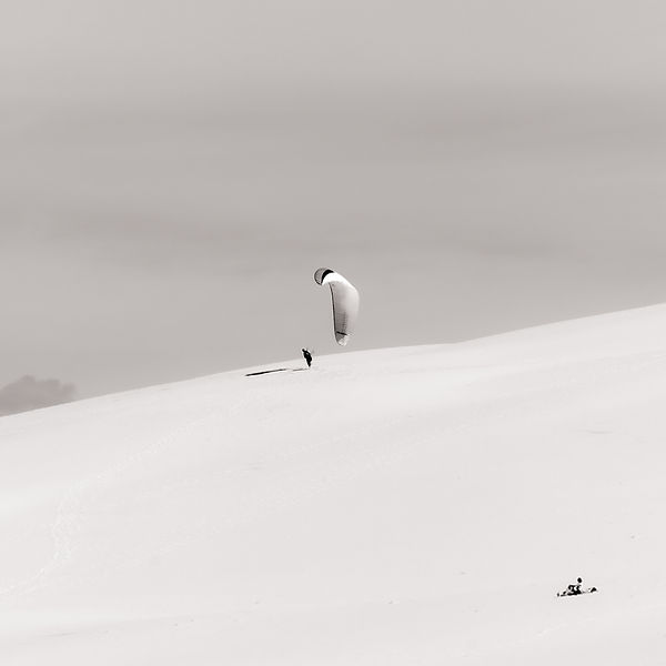 a paraglider trying to take off from a hill