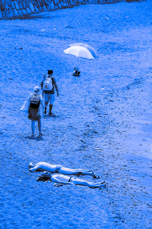 tourists burning on a beach